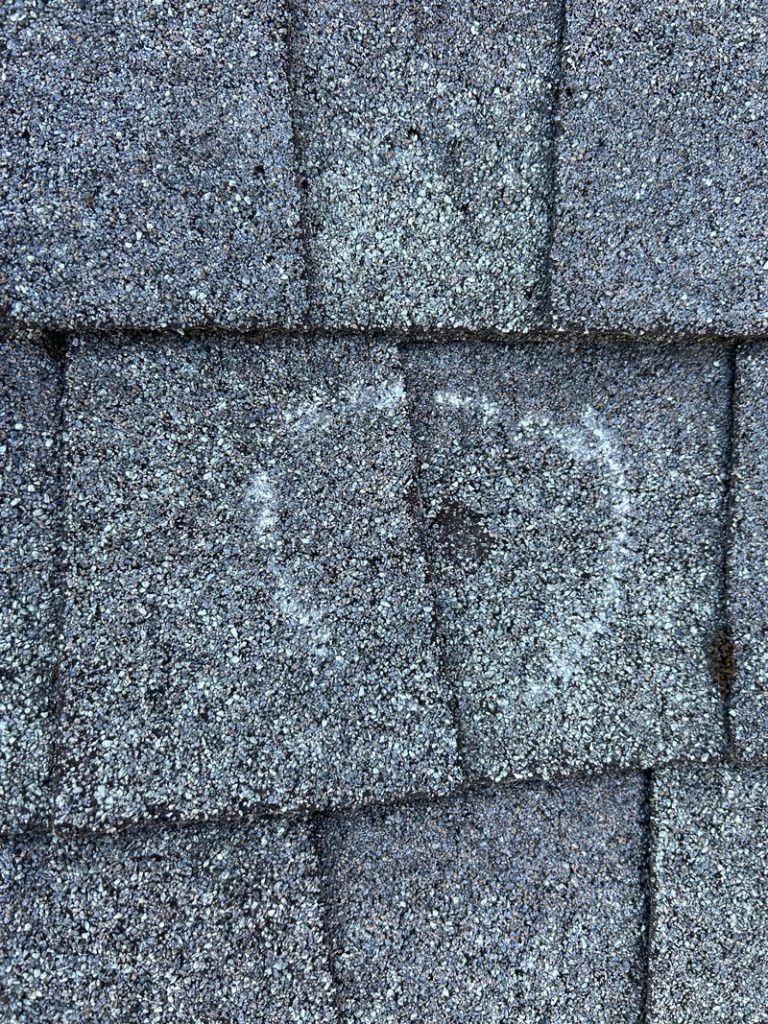 results of hail storm damage on a roof