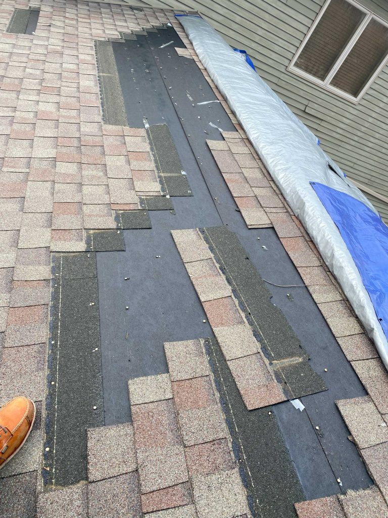 An example of a roof in the middle of a repair, demonstrating the benefits of summer roof repairs in Wisconsin